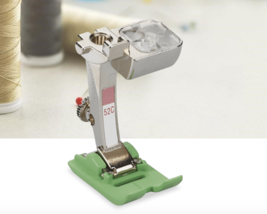 BERNINA Zigzag Foot with Non-Stick Sole #52C Can be used for various applications For all utility and decorative stitches Non-stick coating on the sole ensures it slides smoothly For plastic, vinyl, leather, etc. For 9 mm machines