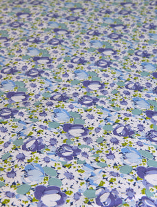 Stamattina 100% Cotton 118" Italian Percale By The Yard Margaux A multi color floral with a mix of daisies and tulips in blue/multi on optic white ground.